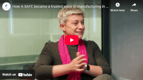 Vanessa Ashworth in a formal office setting, looking excited about the discussion she's having with Liz Churchman about the A-SAFE business and the changes they've seen over 12-months